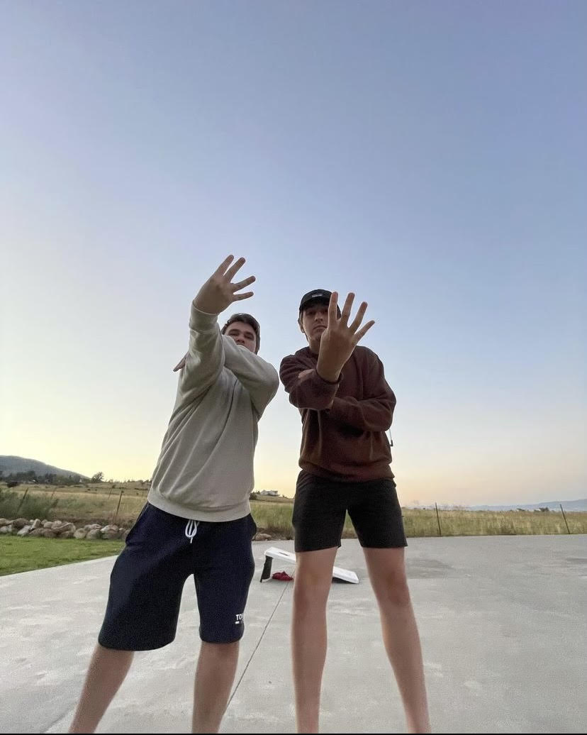 Me on the left, and My brother on the right posing in front of Bear Lake, Utah